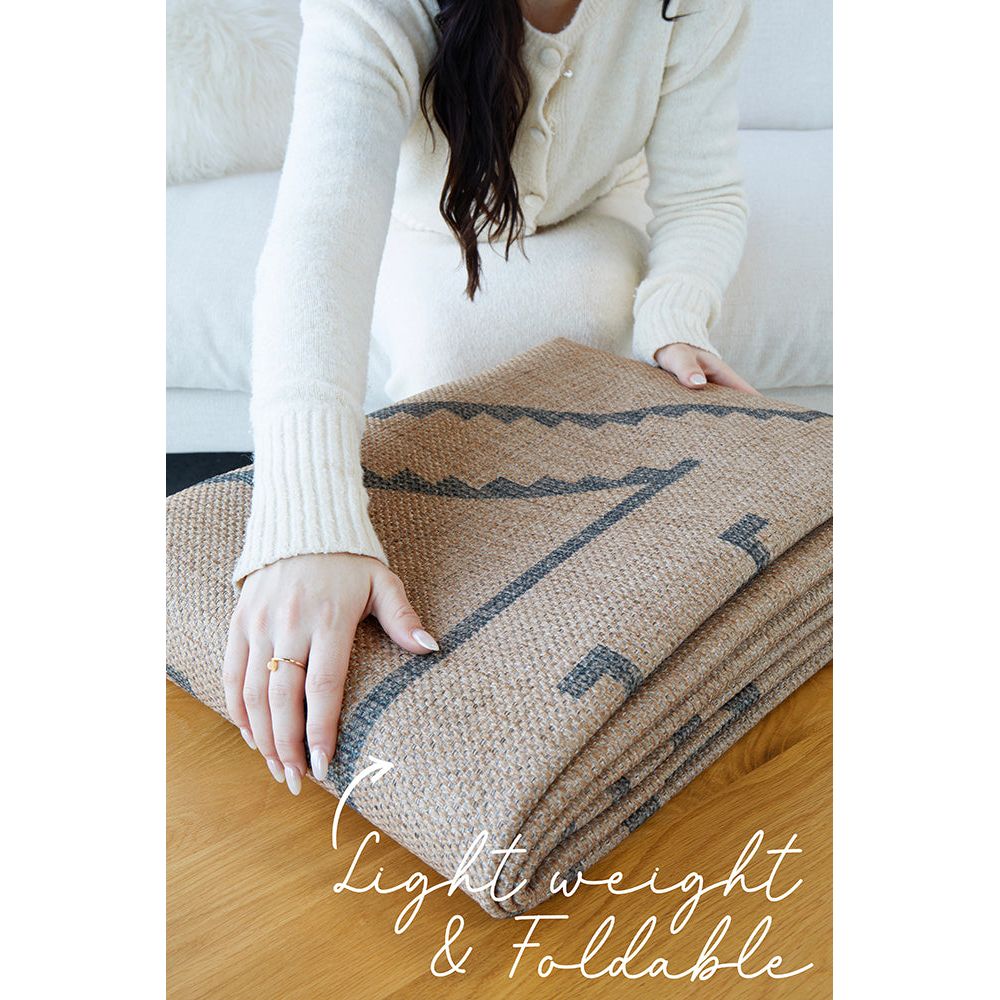 Machine washable modern rug, pictured folded.