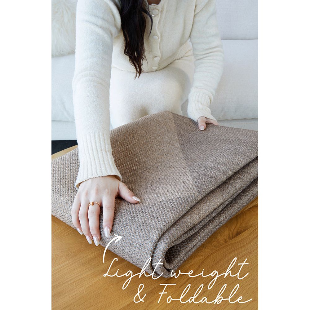 Lightweight, machine washable rug pictured folded.