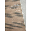 Textured rug with striped pattern on a neutral background