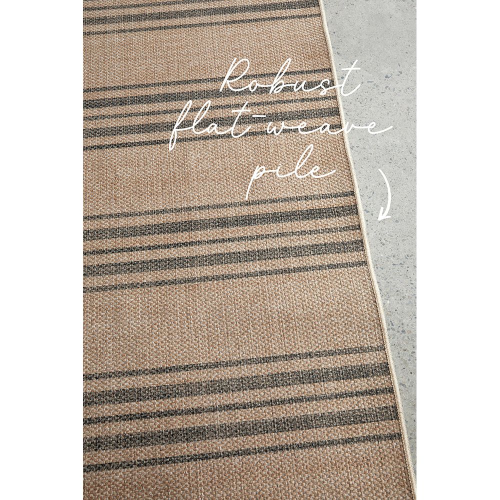 Textured rug with striped pattern on a neutral background