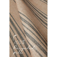 Textured rug with striped pattern and 100% recycled pile.