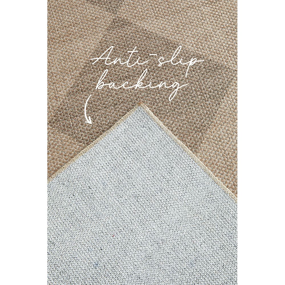 Anti-slip backing of a textured beige patterned rug