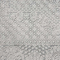 Grey modern rug with intricate textured geometric and floral patterns in a subtle abstract design.