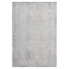 Grey rug with subtle abstract geometric pattern and a slightly distressed look.