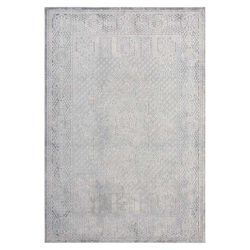 Grey rug with subtle abstract geometric pattern and a slightly distressed look.