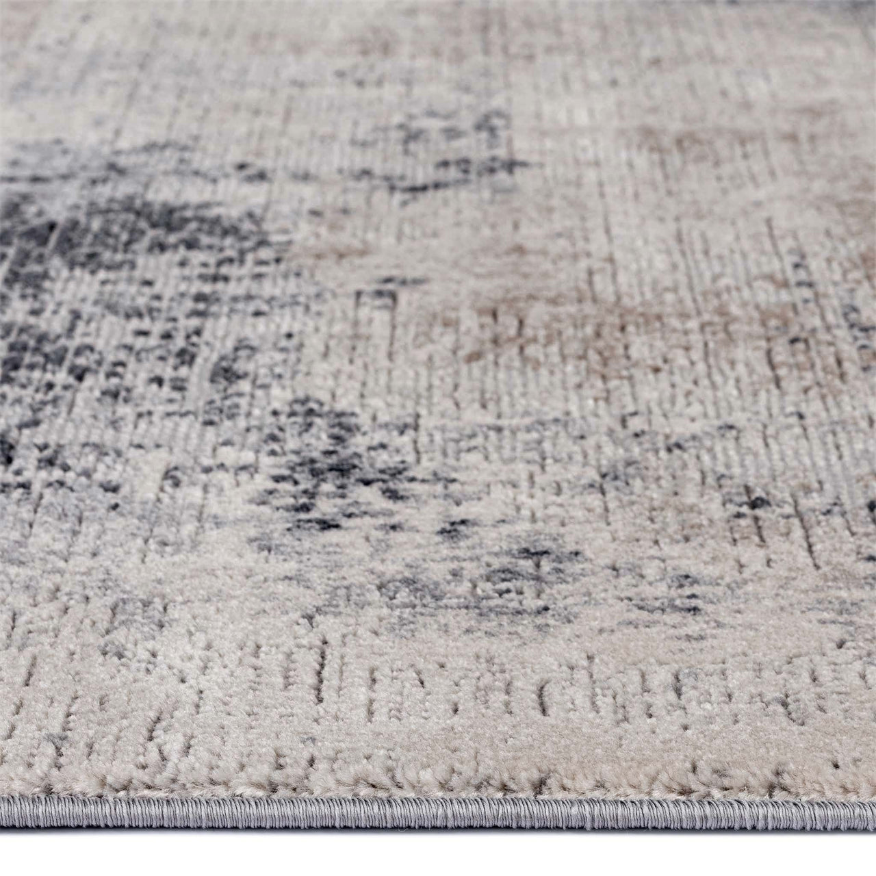 Grey and beige abstract modern runner rug with textured multi-colored pattern and low pile.