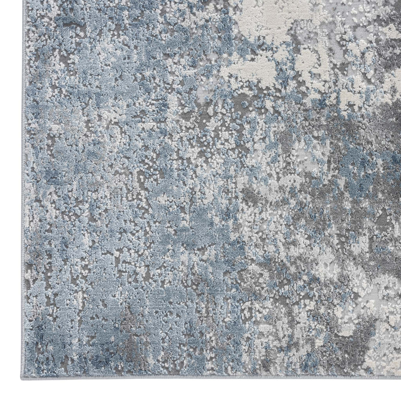 Grey and blue abstract modern rug with textured multi-coloured pattern.