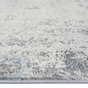 Grey runner rug with abstract multi-coloured pattern in soft blue and white tones, low-shedding texture.