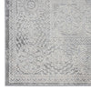 Grey runner rug with intricate floral and geometric abstract patterns in soft tones.