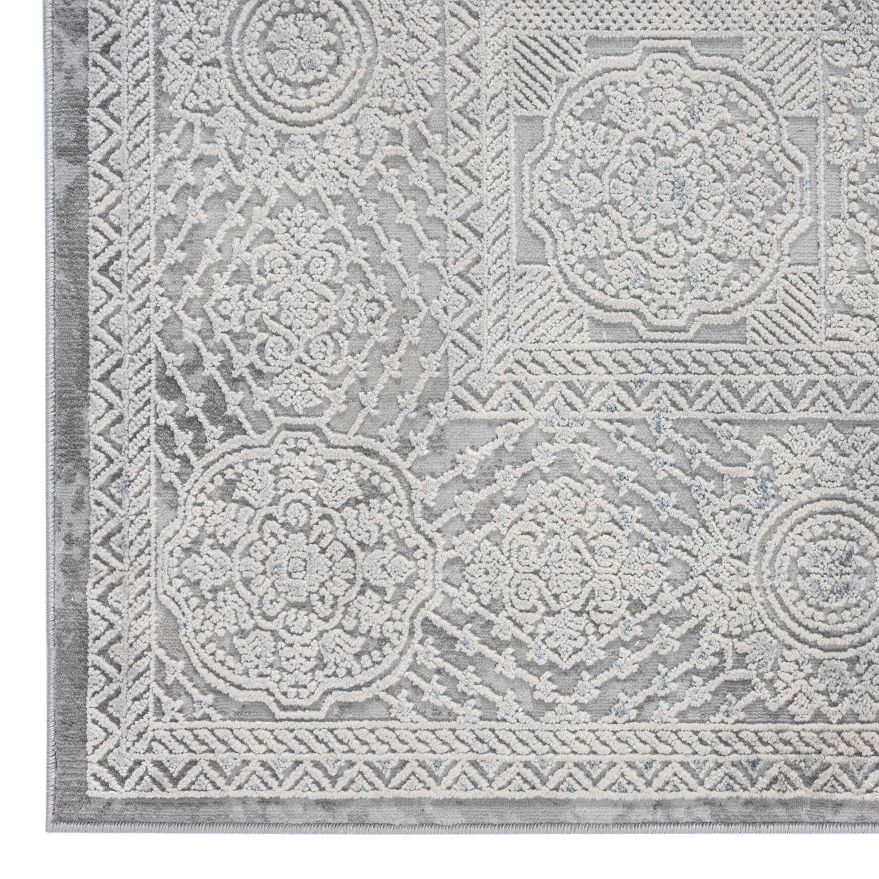 Grey runner rug with intricate floral and geometric abstract patterns in soft tones.