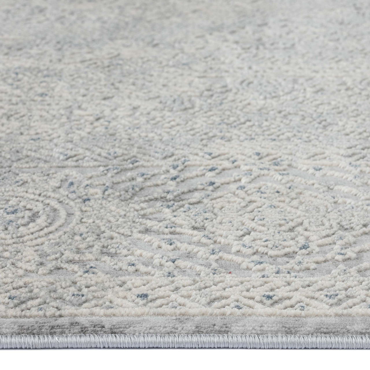 Grey runner rug with subtle abstract textured pattern in multi tones and low pile design.