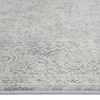 Grey runner rug with subtle abstract textured pattern in multi tones and low pile design.
