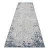 Blue grey abstract modern runner rug with textured multi-colored pattern and distressed edges.