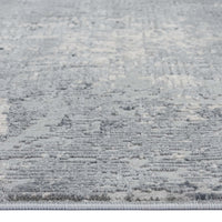 Grey multi-coloured abstract modern rug with textured low-shedding fibers and subtle pattern variations.