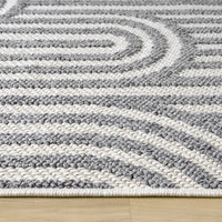 Grey flatweave runner rug with textured geometric arches and a minimalist design.