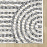 Grey and white flatweave rug with geometric concentric arch pattern and clean edges.