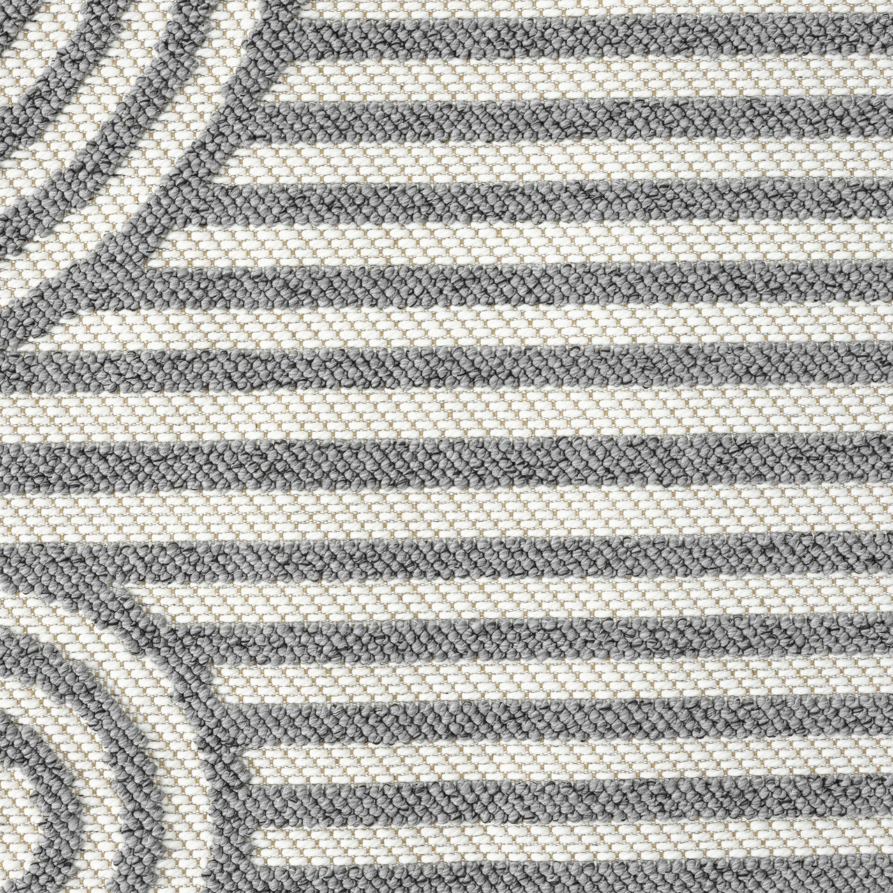 Close-up of grey flatweave rug with geometric arches and stripes pattern in monochrome tones.
