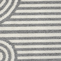 Close-up of grey flatweave rug with geometric arches and stripes pattern in monochrome tones.