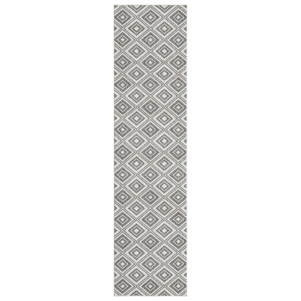 Grey flatweave runner rug with repeating diamond geometric pattern in white and charcoal tones.