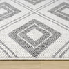 Grey and white flatweave runner rug with geometric square pattern and textured weave on hardwood floor.
