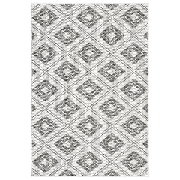 Grey flatweave rug with repeating diamond geometric pattern in varying shades of grey.