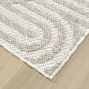 Cream and beige flatweave runner rug with subtle geometric pattern on hardwood floor.