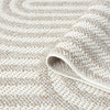 Cream flatweave runner rug with subtle raised geometric arch pattern and textured weave.