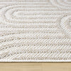 Cream flatweave runner rug with textured geometric patterns on wooden floor.