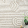 Cream flatweave rug with raised geometric arches pattern and textured stripes.