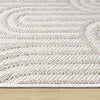 Cream flatweave rug with textured geometric arch patterns and a low-profile design.