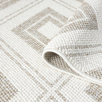 Cream and beige flatweave runner rug with geometric diamond pattern and textured weave.