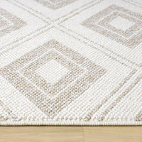 Cream flatweave rug with textured geometric diamond pattern in beige tones on wooden floor.