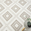 Cream flatweave rug with beige geometric diamond pattern and textured detailing.
