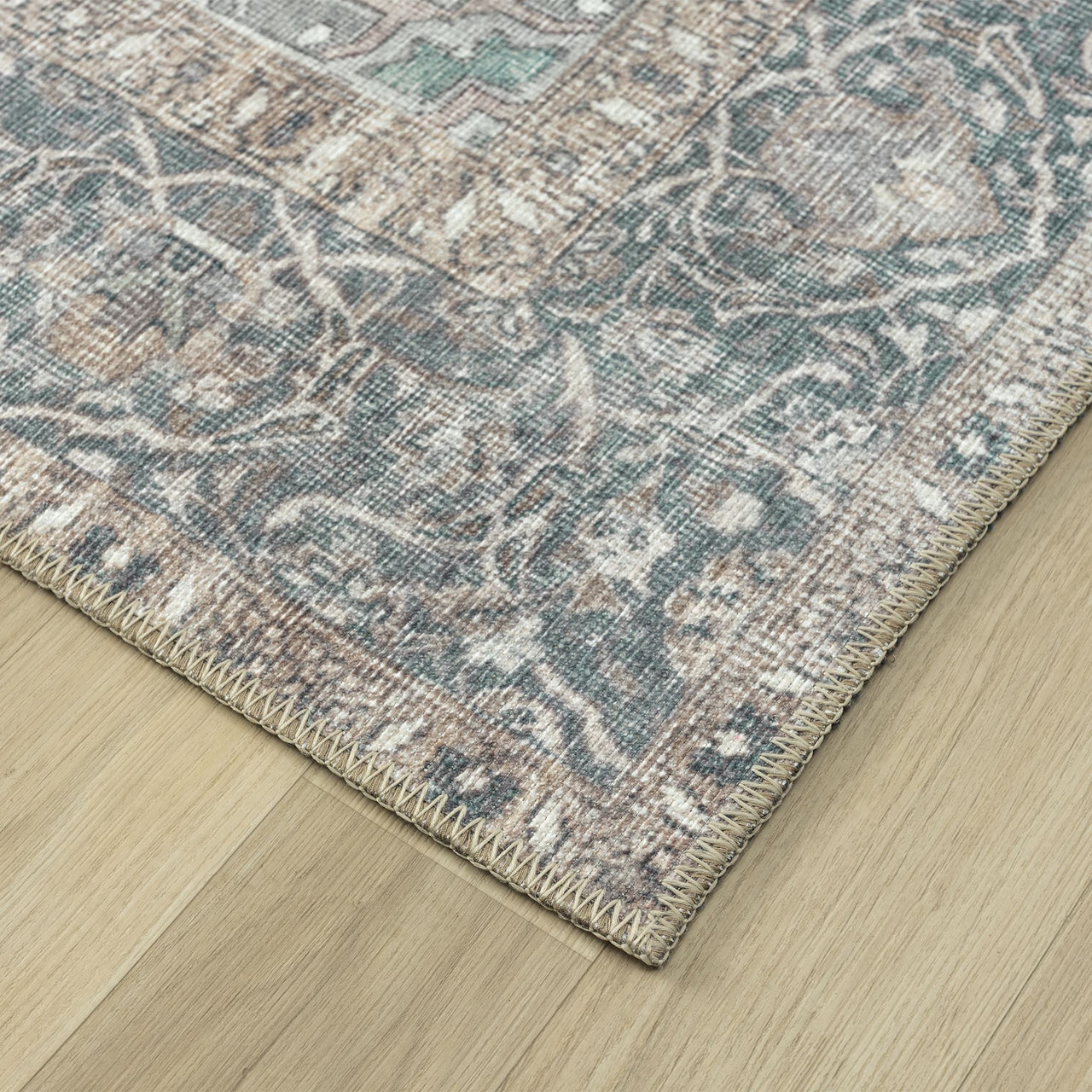 Grey multi-coloured traditional runner rug with floral and intricate distressed patterns on flatwoven texture.