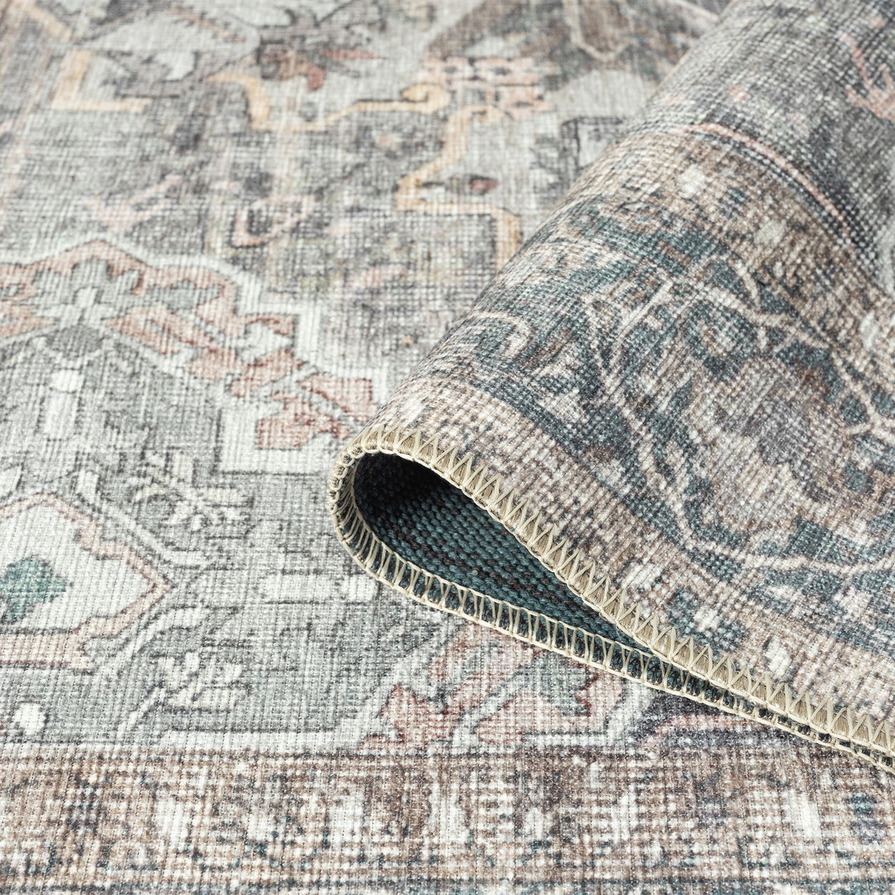 Grey multi-colored traditional runner rug with intricate floral and geometric patterns, flatwoven texture.