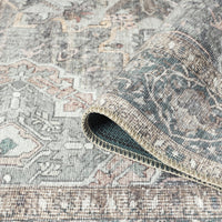 Grey multi-colored traditional runner rug with intricate floral and geometric patterns, flatwoven texture.