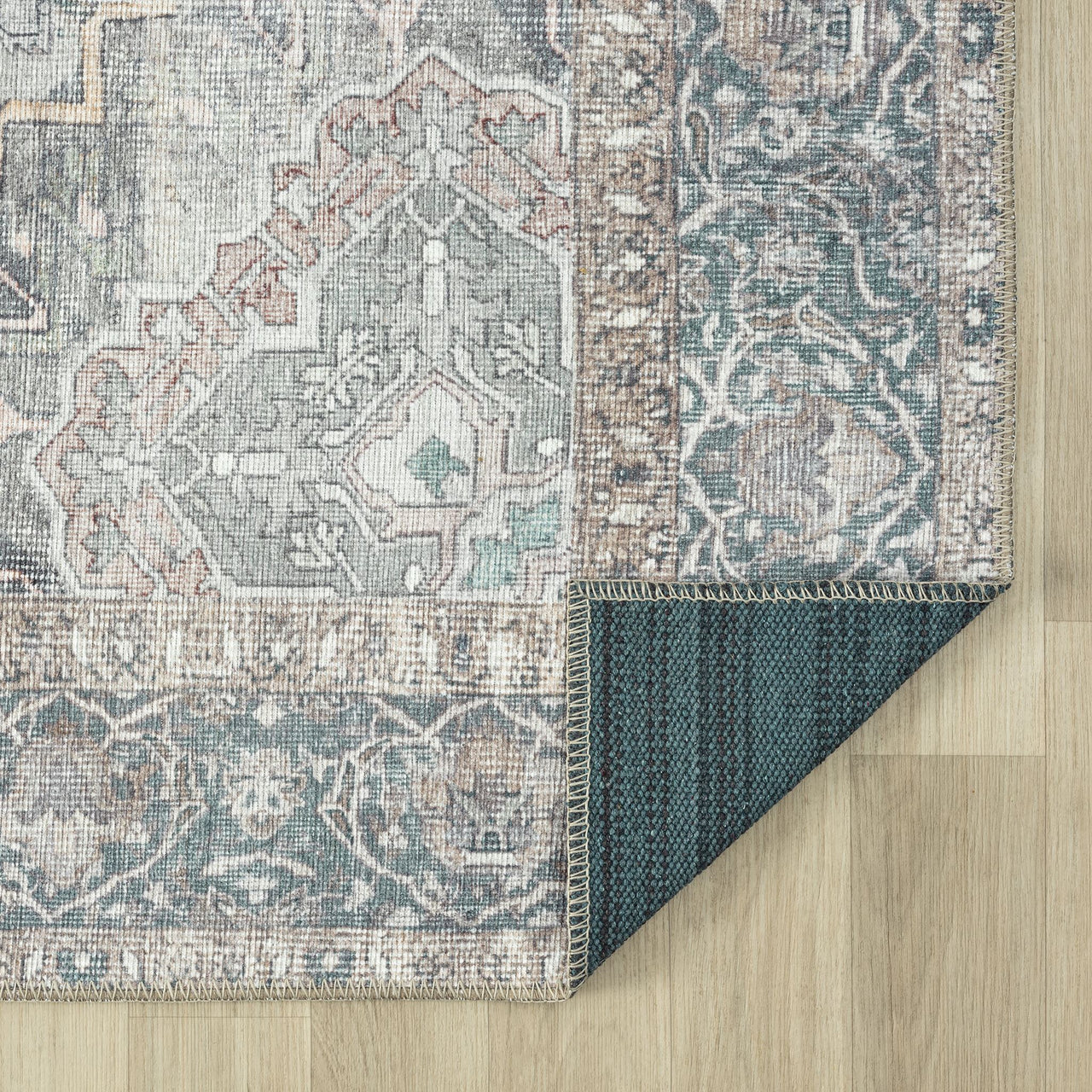 Grey multi-colored traditional runner rug with floral and geometric patterns, flat-weave texture.