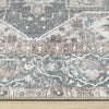 Grey multi-colored runner rug with intricate traditional floral patterns and distressed flatweave texture.