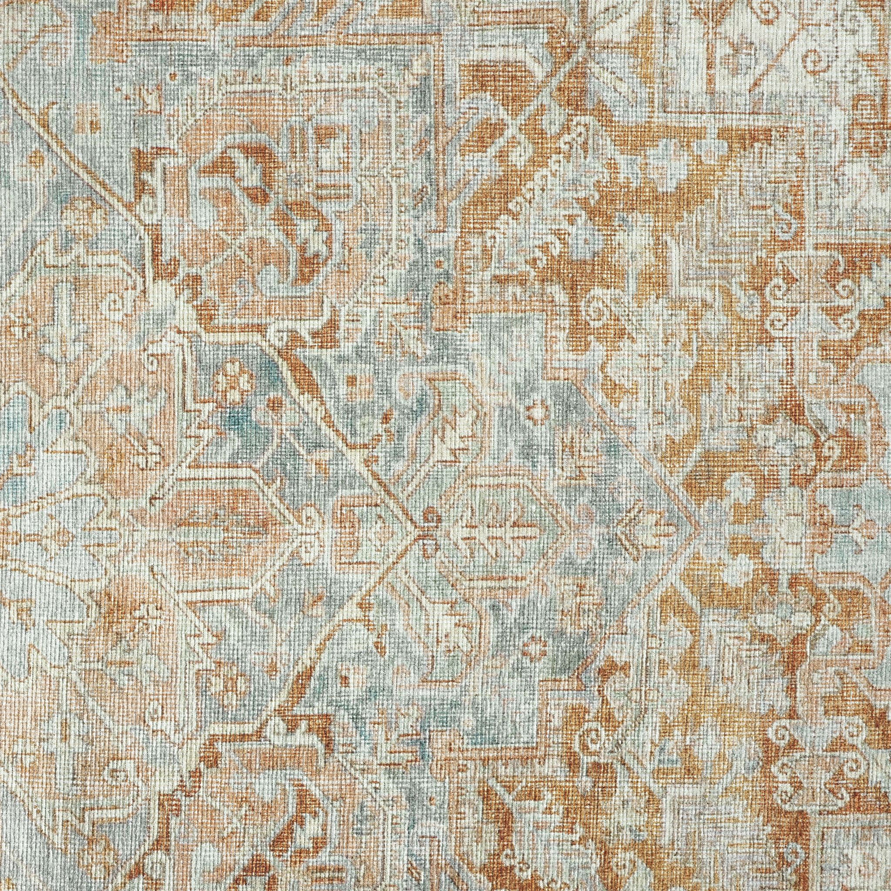 Traditional runner rug with distressed multi-colored floral and geometric patterns in soft blue, beige, and brown tones.