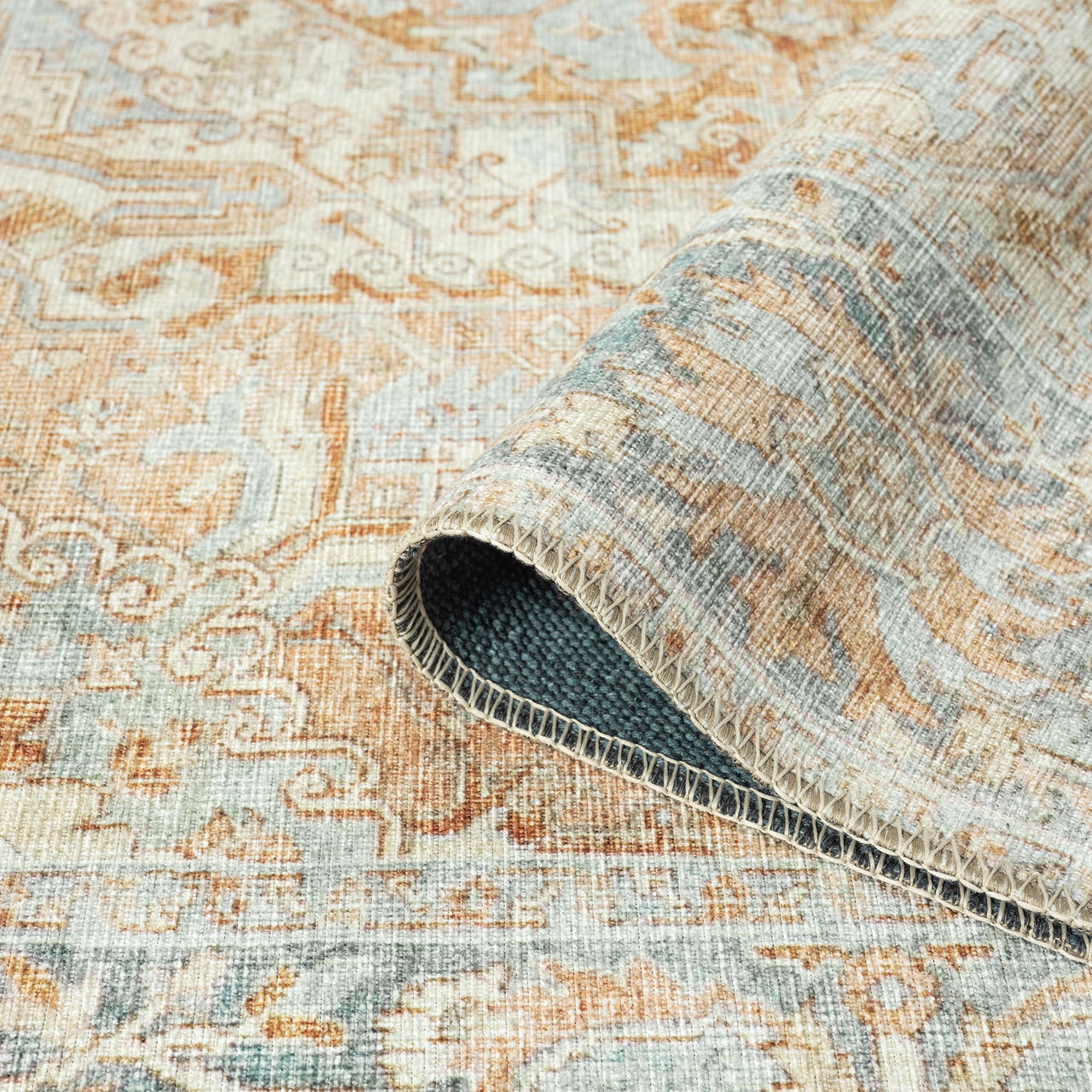 Multi-colored traditional runner rug with floral and geometric patterns in beige, blue, and rust tones, flatwoven texture.