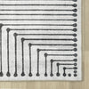 Black and white geometric patterned flatweave runner rug with beige border.