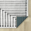 Black and white geometric patterned traditional flatweave runner rug with beige edges and teal backing.
