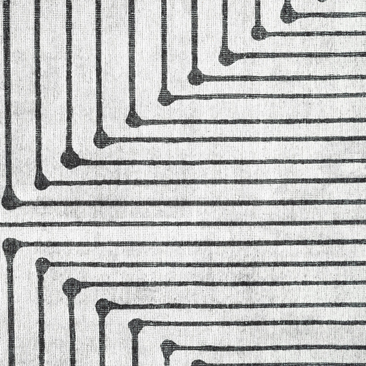 Black and white geometric pattern with concentric rectangles and small circular accents on a flatweave rug.