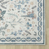 Traditional runner rug with multi-colored floral tree pattern in soft blues and muted reds on a light background with.