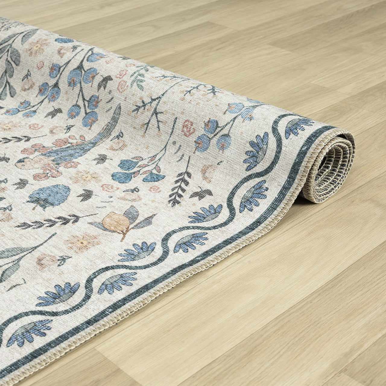 Traditional runner rug with multi-coloured floral and tree motifs on a cream background, bordered with blue wave and leaf.