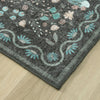 Grey flatweave runner rug with teal, pink, and cream floral motifs and curved border design.