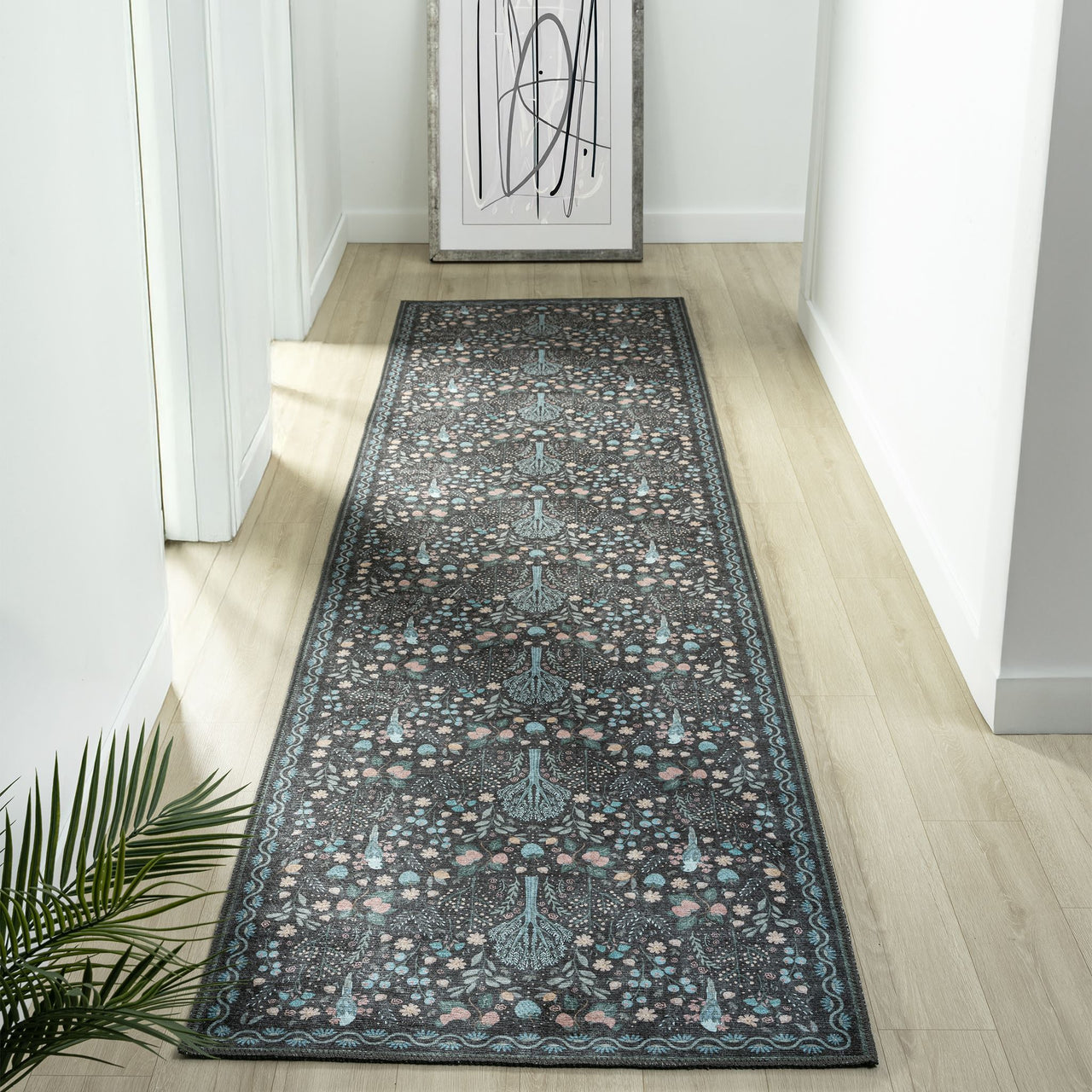 Grey traditional runner rug with intricate multi-colored floral pattern and distressed flatweave texture.