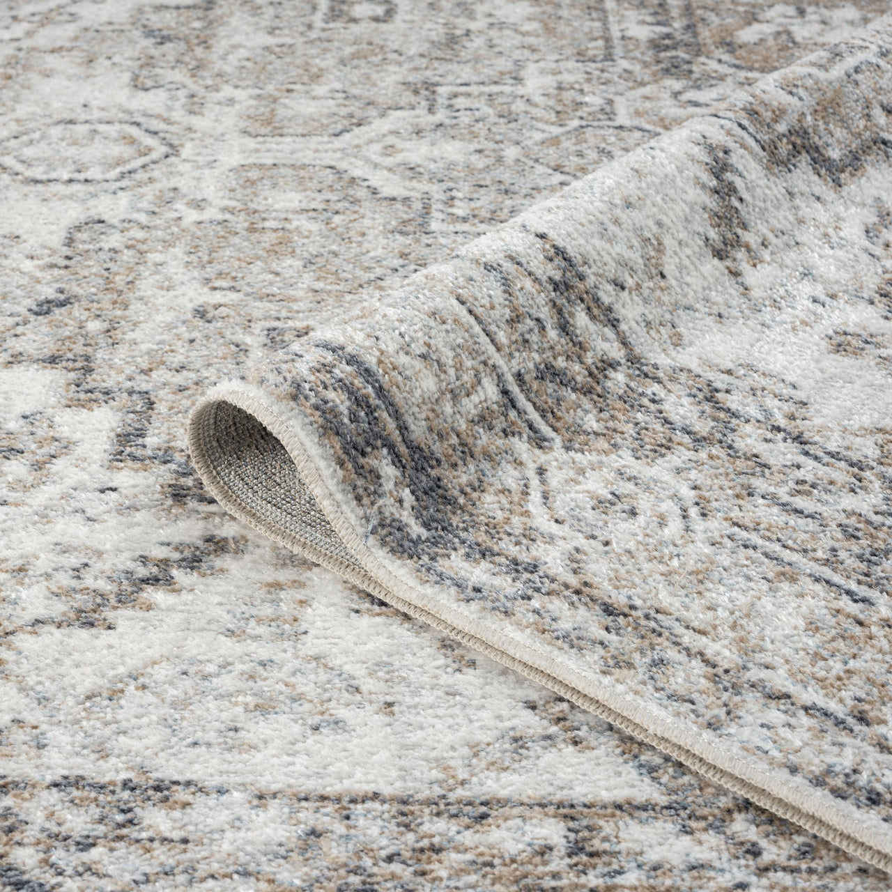 Multi-colored transitional runner rug with muted earth tones and intricate modern pattern.