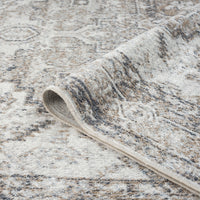 Multi-colored transitional runner rug with muted earth tones and intricate modern pattern.