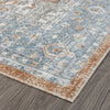 Blue multi-colored transitional rug with geometric patterns and a rust-colored border on hardwood floor.